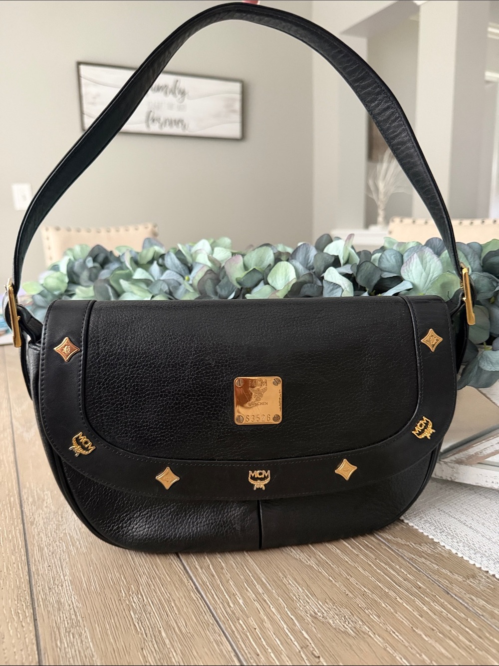MCM Black Leather Shoulder Bag with Gold Logo Accents